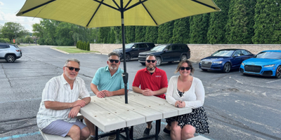 Business Development team by the picnic table wearing sunglasses